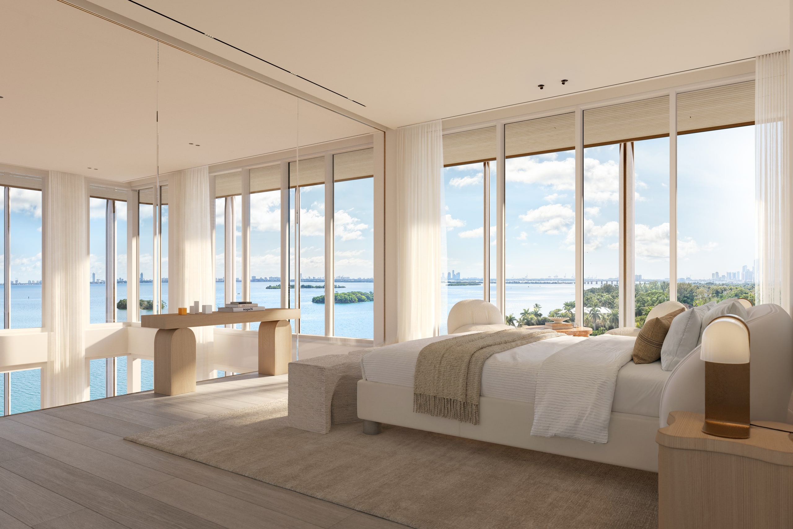 Penthouse primary bedroom with wraparound glass